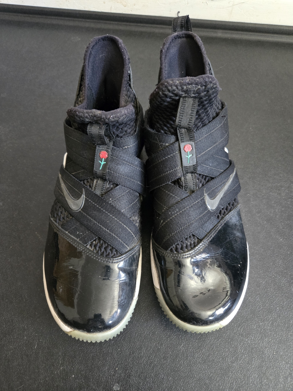 Nike Kids' Black Slip-On Athletic Shoes with Rose Accent